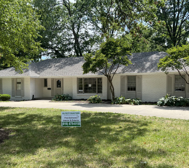 painted house with the branded sign of elite 77 painters