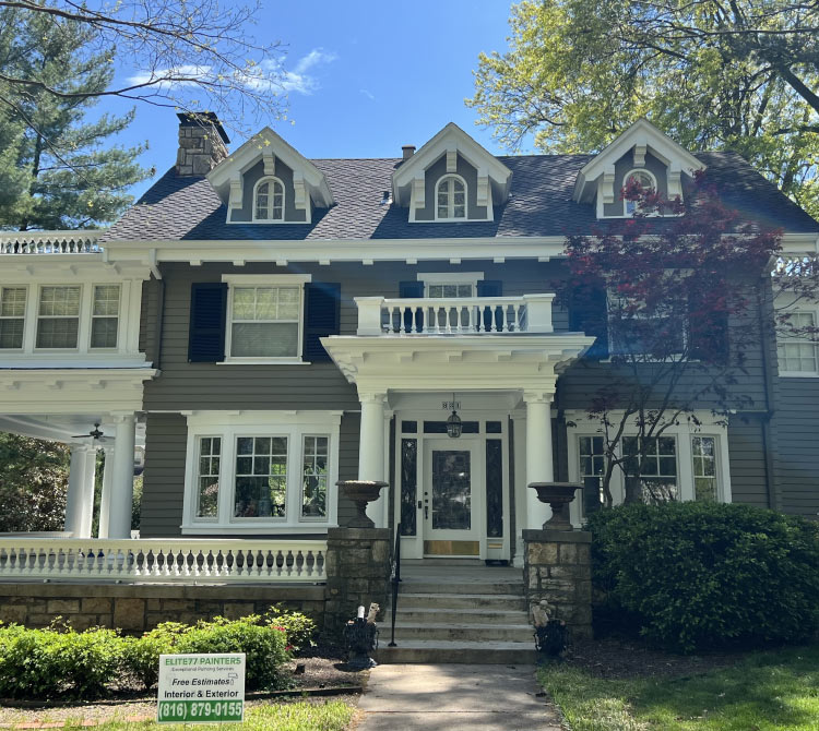 Luxury historic home exterior repaint in Kansas City, highlighting detailed white trim and dark gray siding by Elite77 Painters