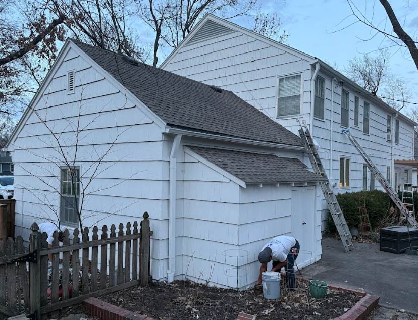 Elite77 Painters team performing exterior trim repair and wood rot repair prevention on a residential property to ensure long-term structural integrity.
